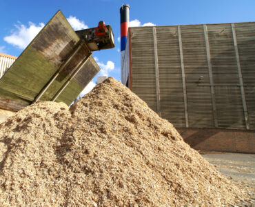 bio-power-plant-with-storage-of-wooden-fuel-agains-2026-03-26-07-55-14-utc